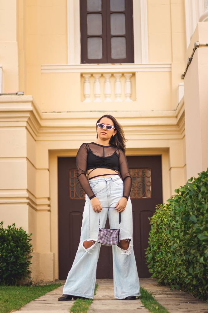 Artist posing for a photo outside
